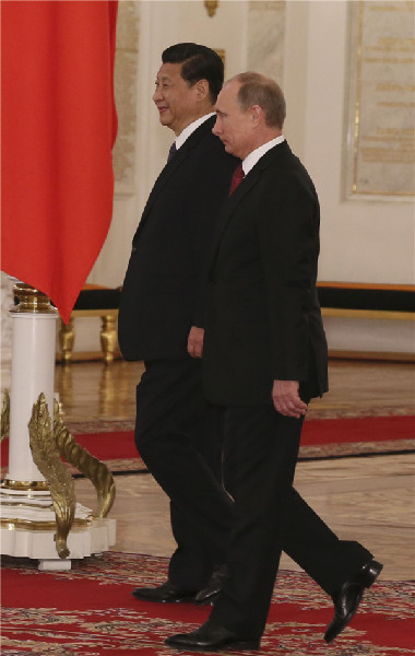 Visiting Chinese President Xi welcomed by Putin