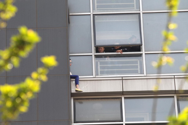 Woman saved after suicide attempt at Beijing office building