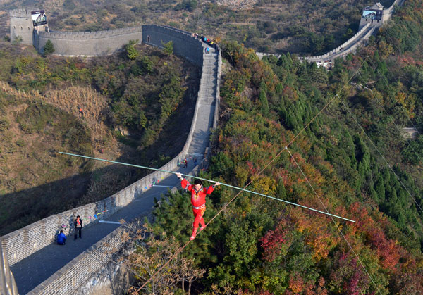 Tightrope walker Adili walks above the Great Wall