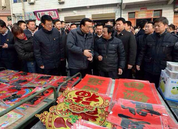 Li visits isolated county in NW China