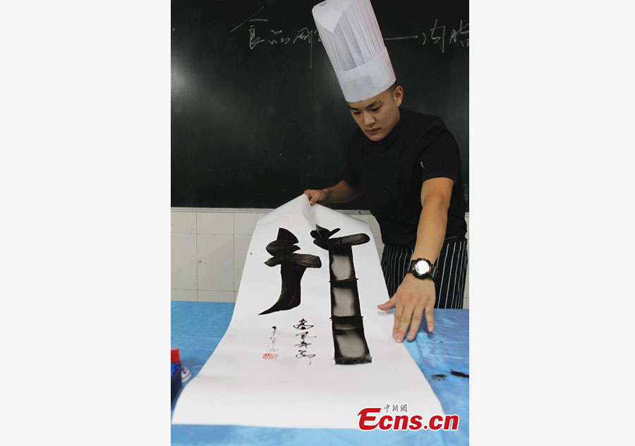 Man writes Chinese calligraphy using kitchenware