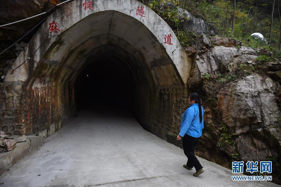 Female villager digs tunnel linking isolated village to outside world