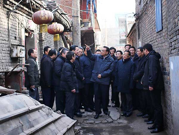 Improvements on way, Li tells shantytown