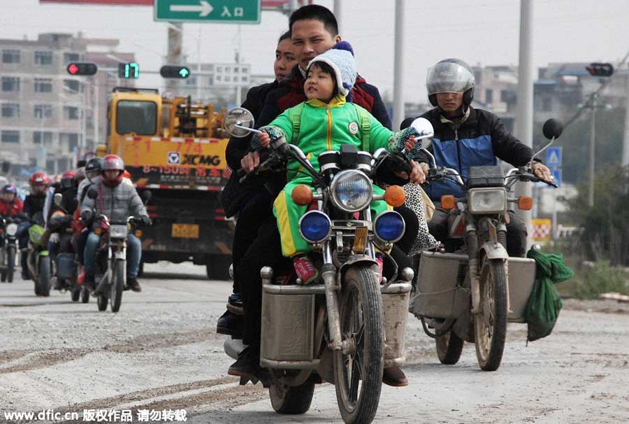 Migrant workers riding motorcycles home for Spring Festival reunion