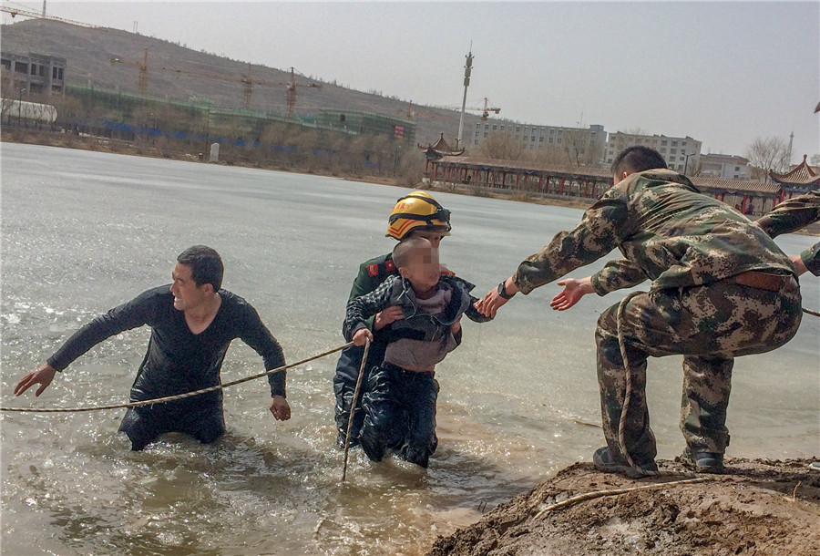 Firefighters rescue boys who fell through thin ice in NW China