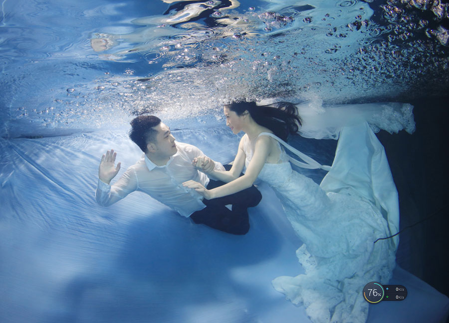 University students go underwater to celebrate graduation