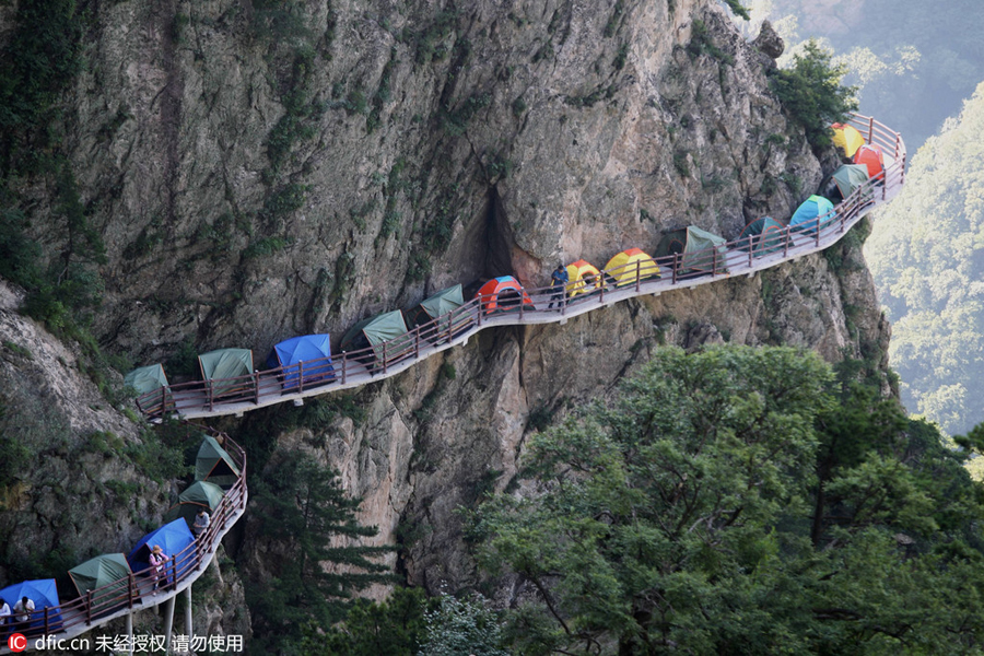 Campers sleep perched on cliff face
