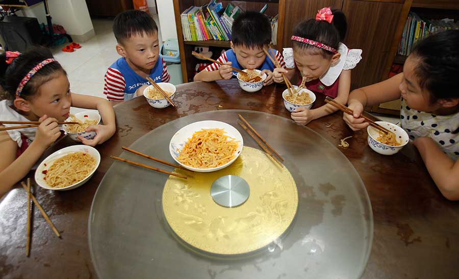 Four of a kind: Quadruplets get ready for school in Changsha
