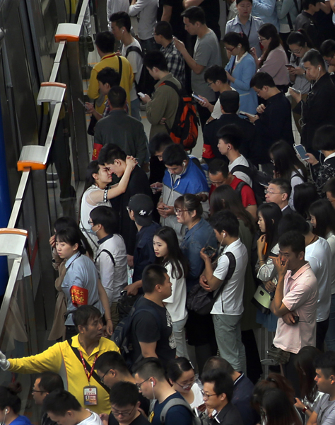 In Beijing, expansion, rising property prices lead to longer commutes