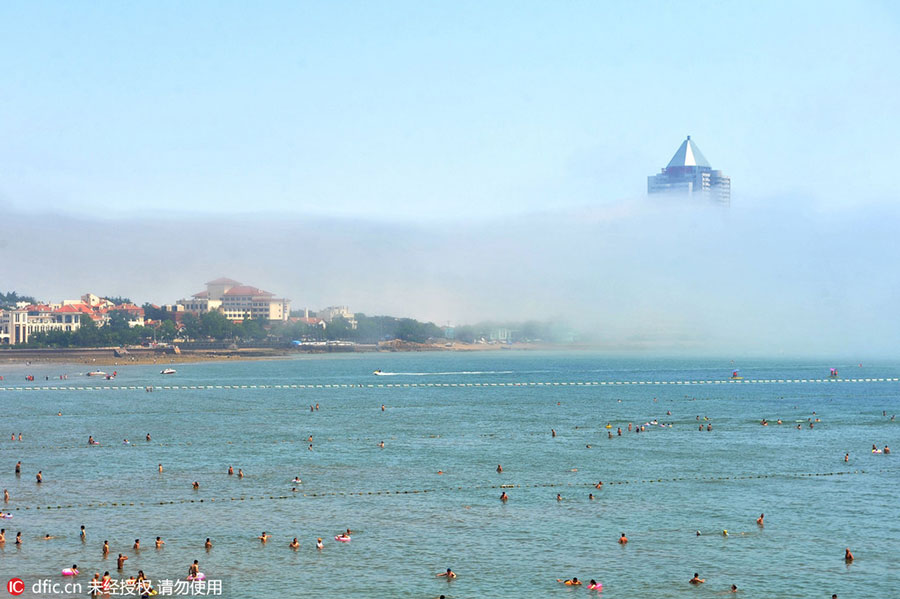 Rising above the clouds: Mist envelops Qingdao