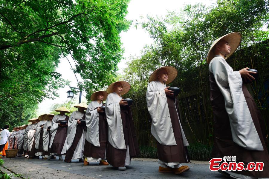 Monks walk for charity on birthday of Buddha