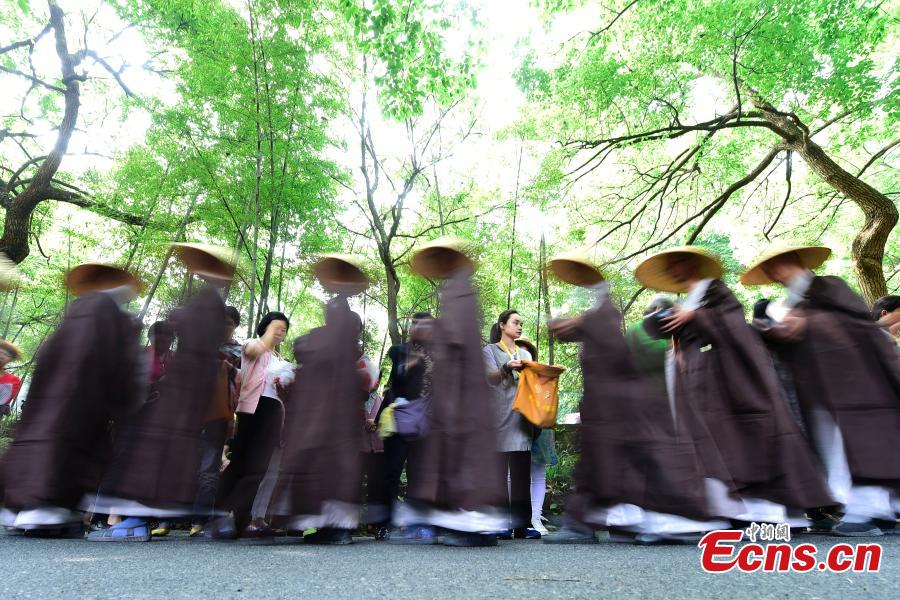 Monks walk for charity on birthday of Buddha
