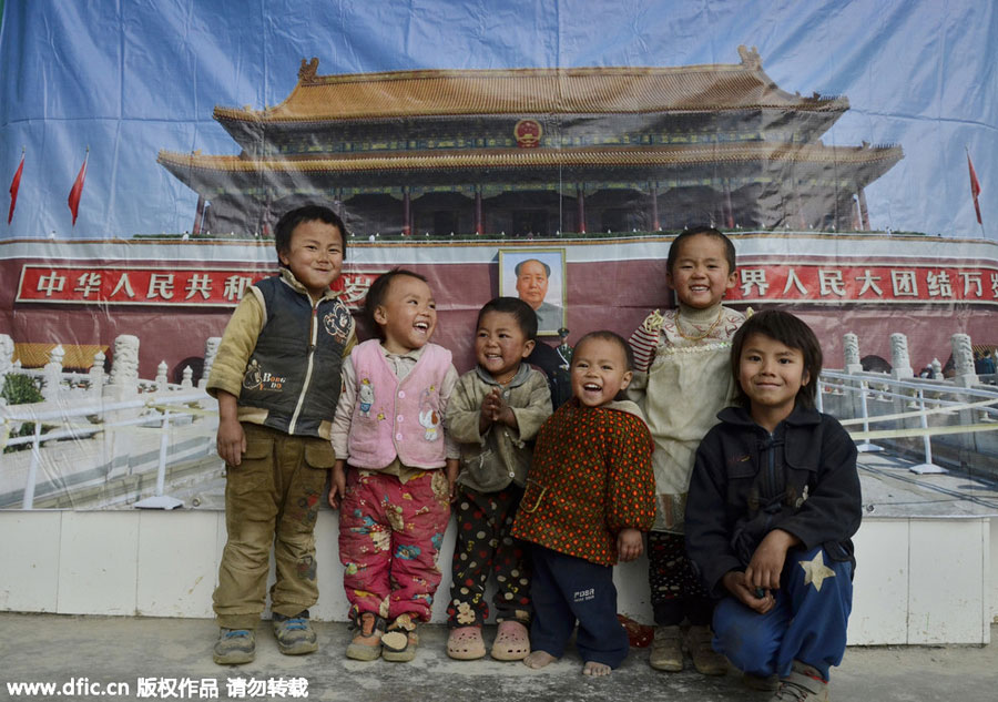 Young photographer takes family photos for mountain-dwellers