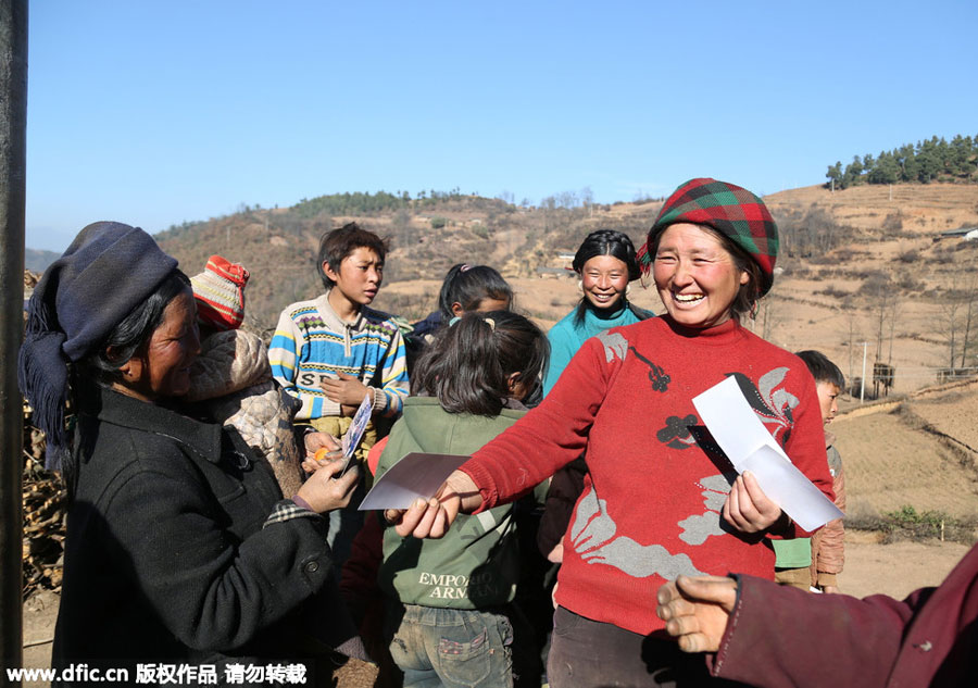 Young photographer takes family photos for mountain-dwellers