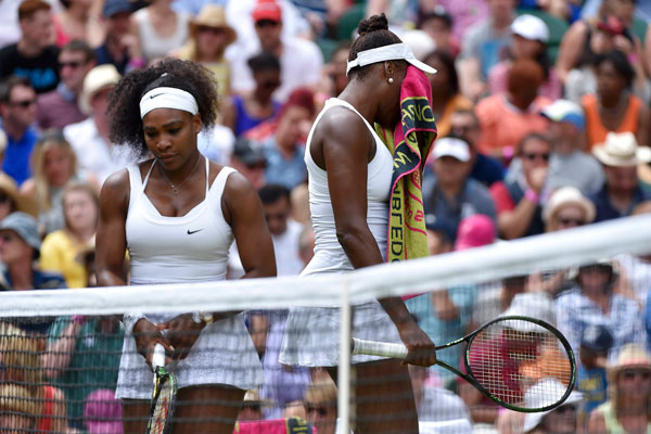 Serena Williams beats sister Venus to reach last eight