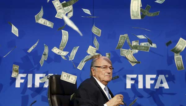 Blatter showered with paper money before unveiling FIFA reform plan