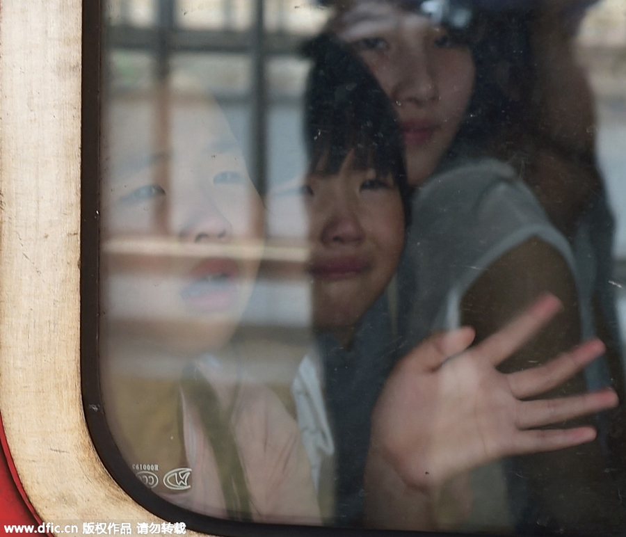 Goodbyes and tears as left-behind children head home