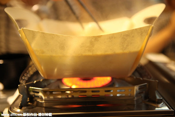 Eat from a paper hotpot