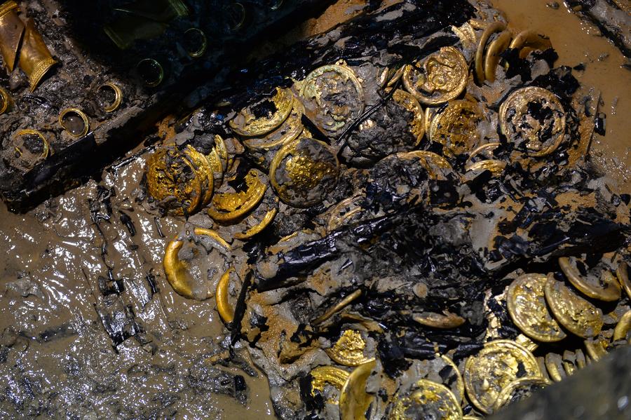 Gold coins, hoofs found in 2,000-year-old Chinese tomb