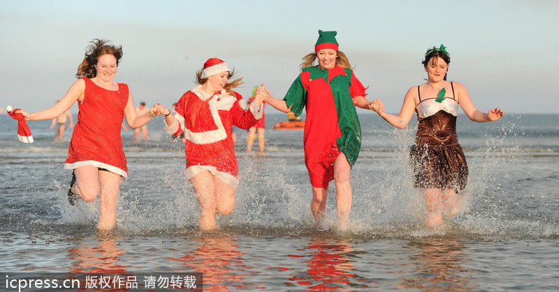 Hundreds in UK take Boxing Day dip for charity