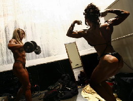 Bodybuilders prepare backstage before competition