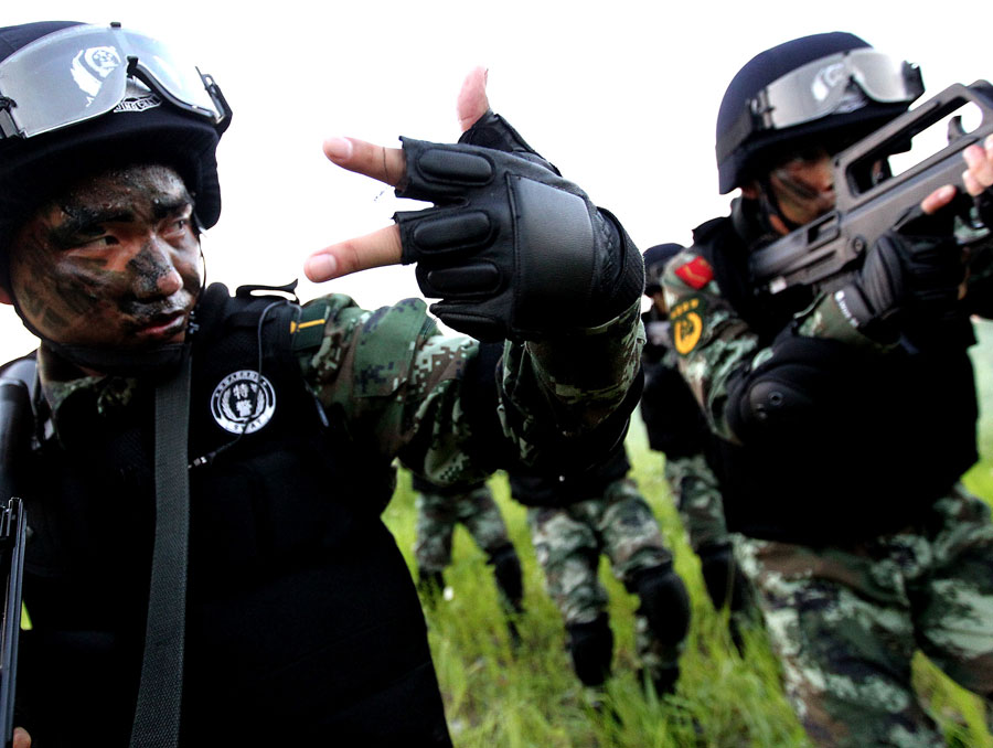 Armed policemen conduct combat exercises in Shanghai