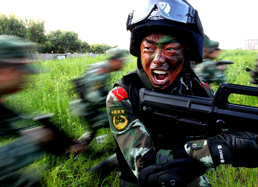 Armed policemen conduct combat exercises in Shanghai