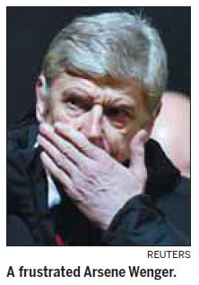 Wenger defends another disaster