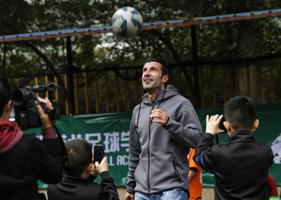 Figo charms soccer fans in Guangzhou