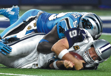 Panthers still perfect, Romo hurt again in 33-14 Dallas loss