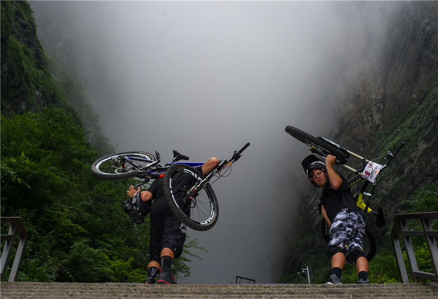 Uphill battle for cyclists in downhill race in Zhangjiajie