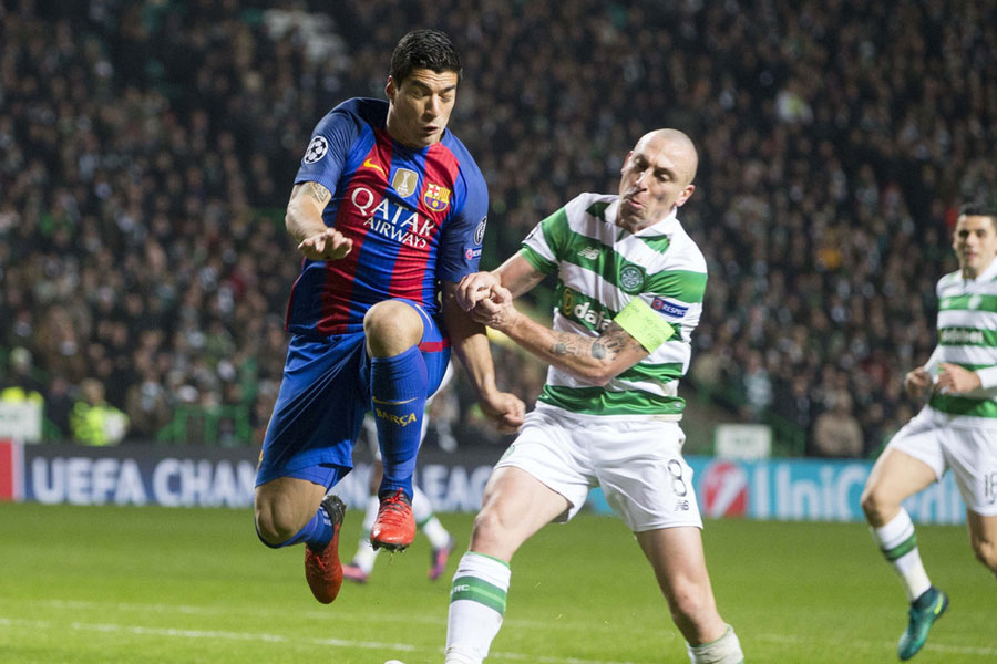 Messi double guides Barcelona to 2-0 win at Celtic