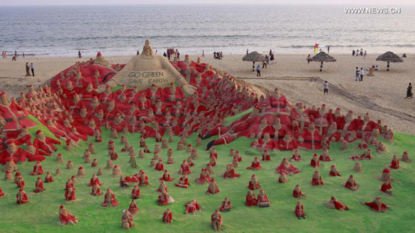 Artists create sand sculptures on beach of Puri, India