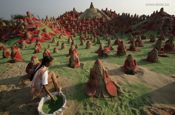 Artists create sand sculptures on beach of Puri, India