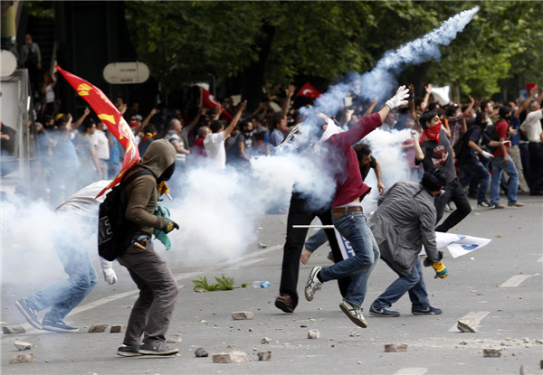 Thousands take to streets in Turkey, clash with police