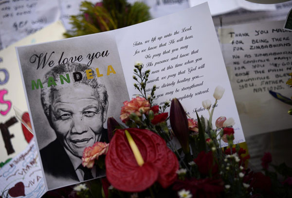 Mandela's condition 'improving' as Obama flies in