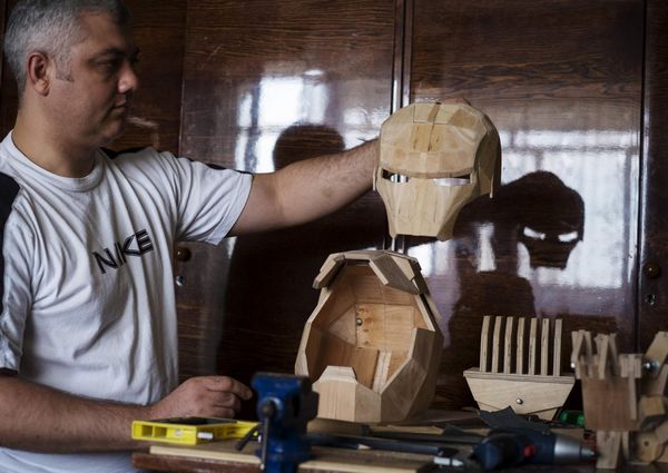 Crane operator creates wooden robot