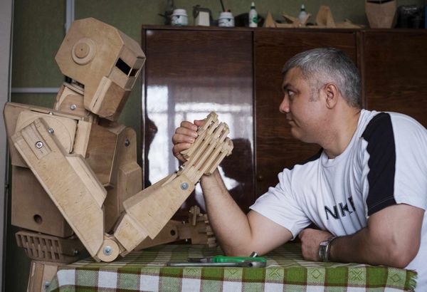 Crane operator creates wooden robot