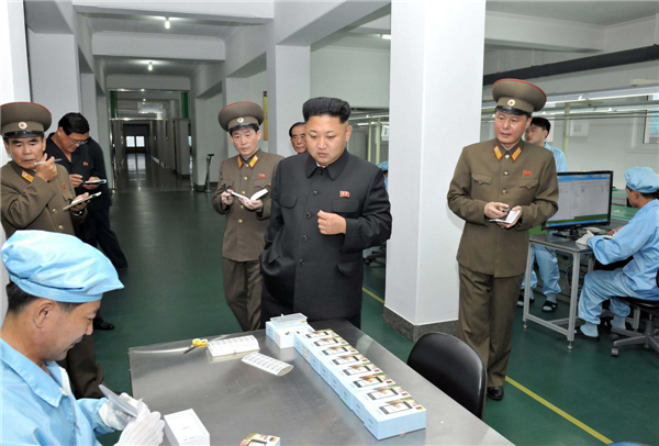 Kim Jong-un visits mobile phone factory