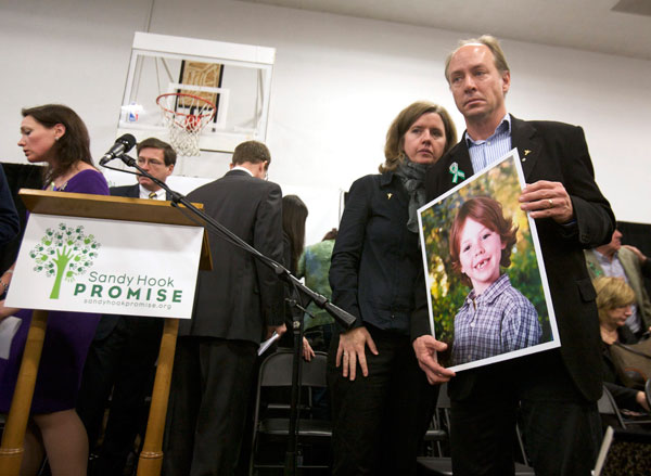 Newtown families mark anniversary with a plea for parents to unite