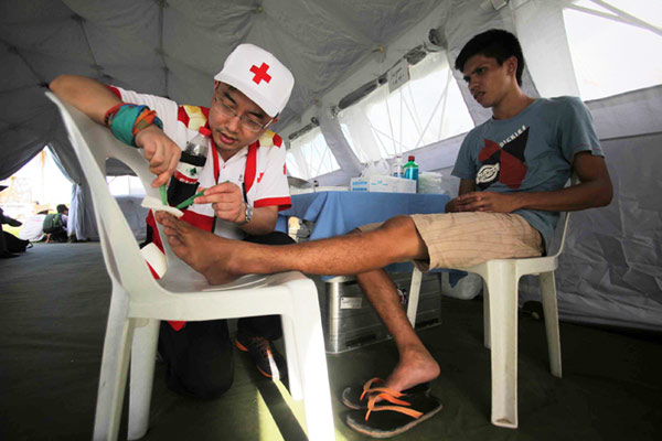 Rescuers work in Tacloban