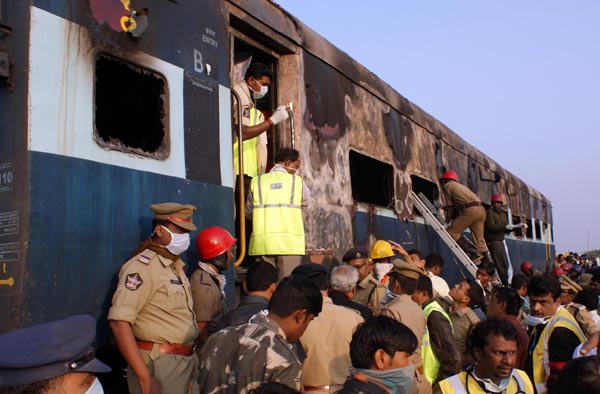 Fire on express train in India kills at least 26