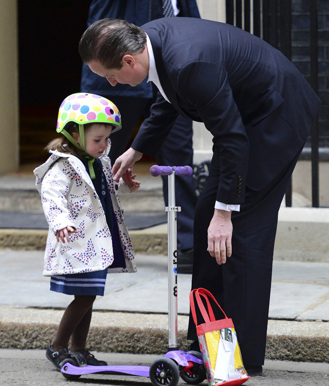 Cameron walks his daughter to nursery school