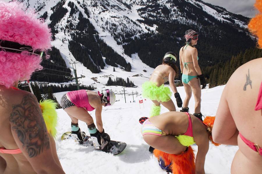 Skiing or snowboarding in bikinis or shorts