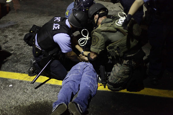 Police move against protesters as calm dissolves in Missouri