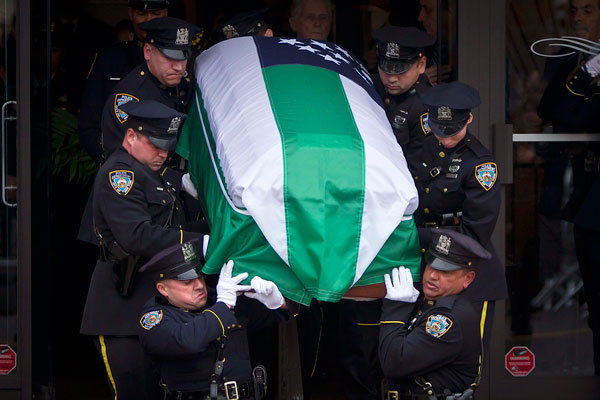 Thousands see off slain police officer