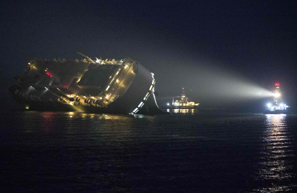8 missing after cargo ship capsizes