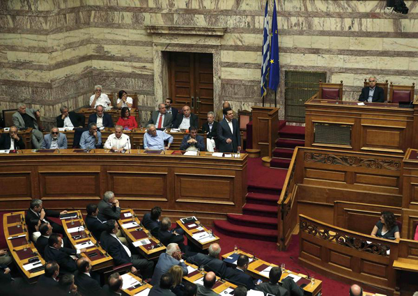 Greek parliament approves debt deal and first reforms