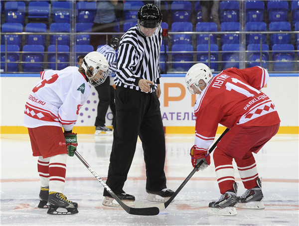 Putin takes part in hockey game against students in Russia