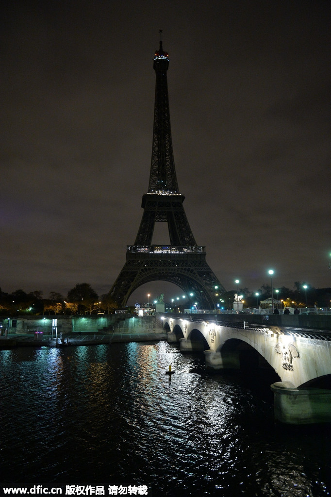 Eiffel Tower goes dark as France mourns terrorist attack victims